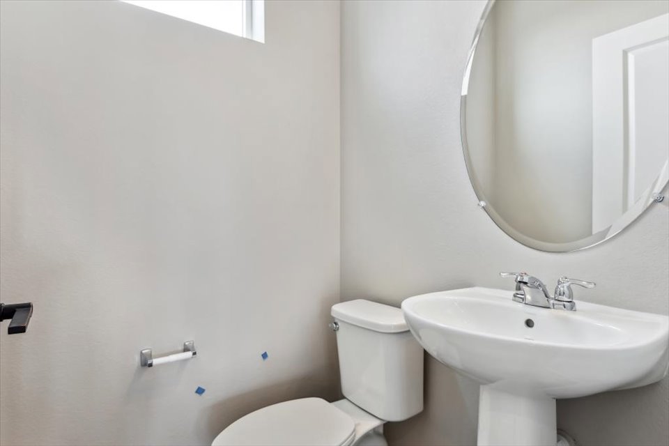 A bathroom with a sink and toilet.