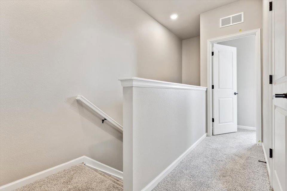 A white room with a white cabinet.