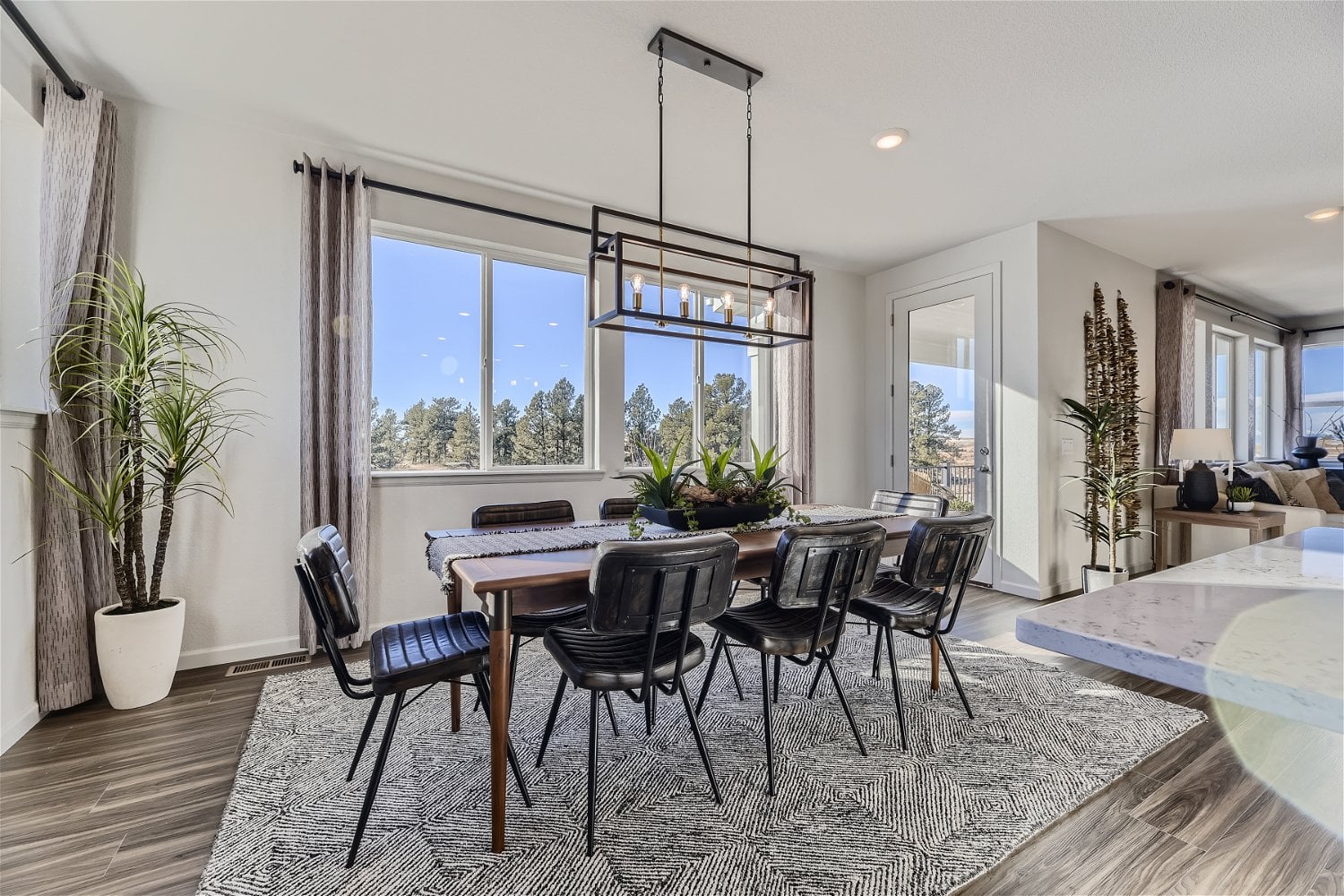 A dining room with a large window.
