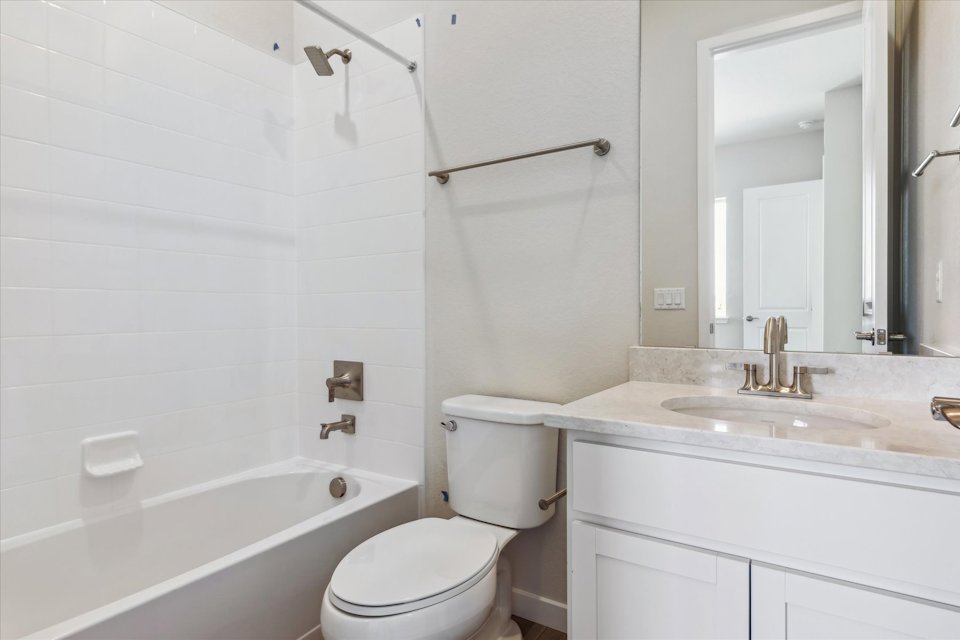 A bathroom with a toilet and sink.