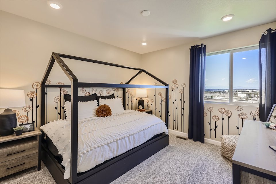 A bedroom with a large bed.