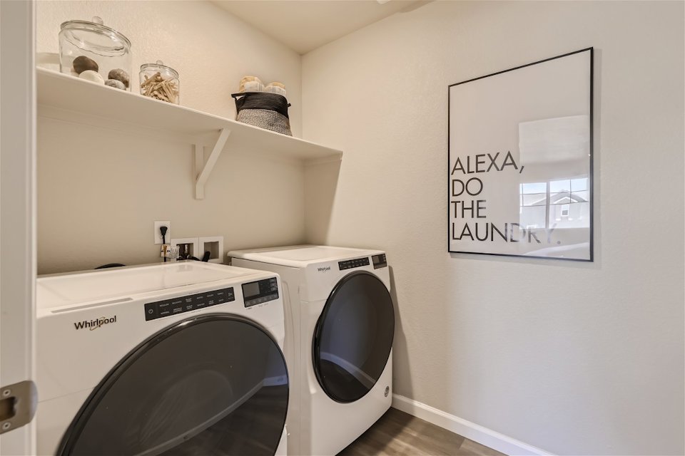 A washer and dryer in a room.