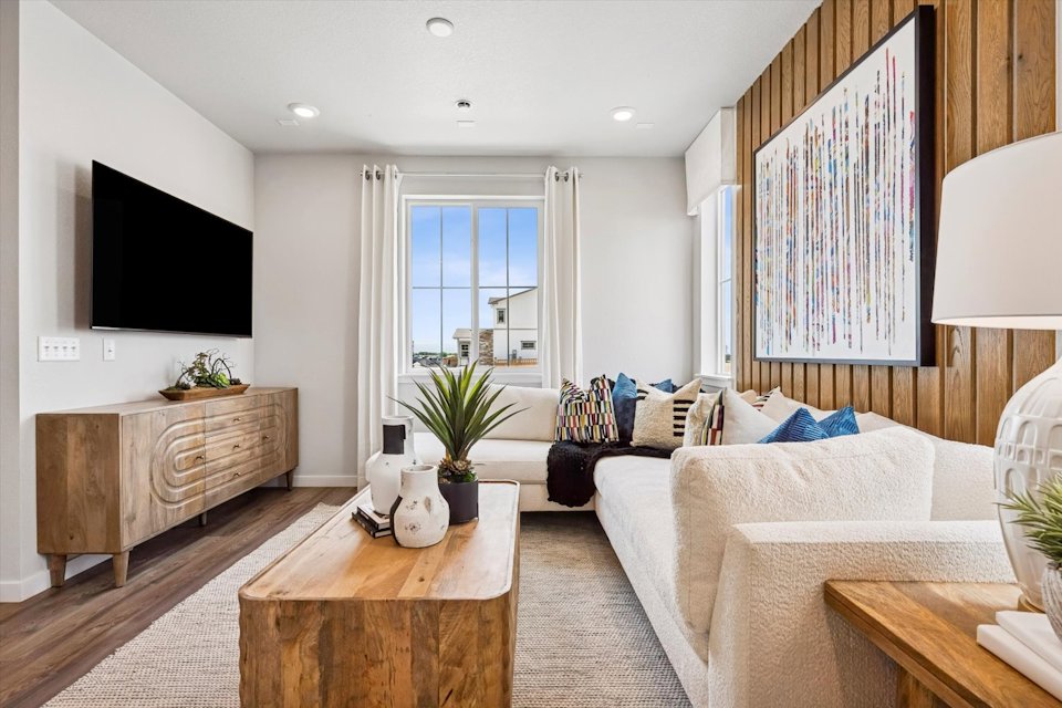 A living room with a tv and couches.