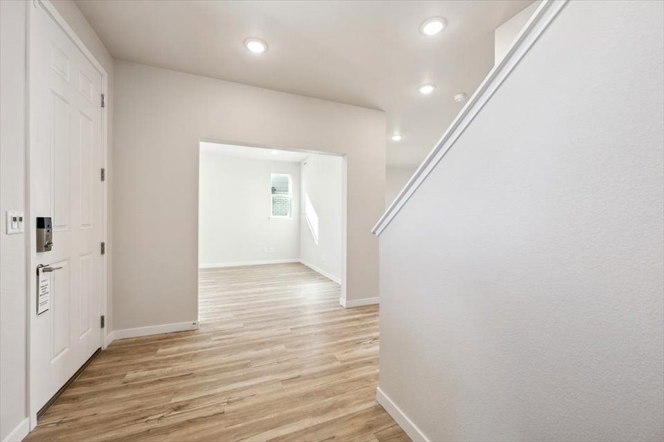 A hallway with white walls.