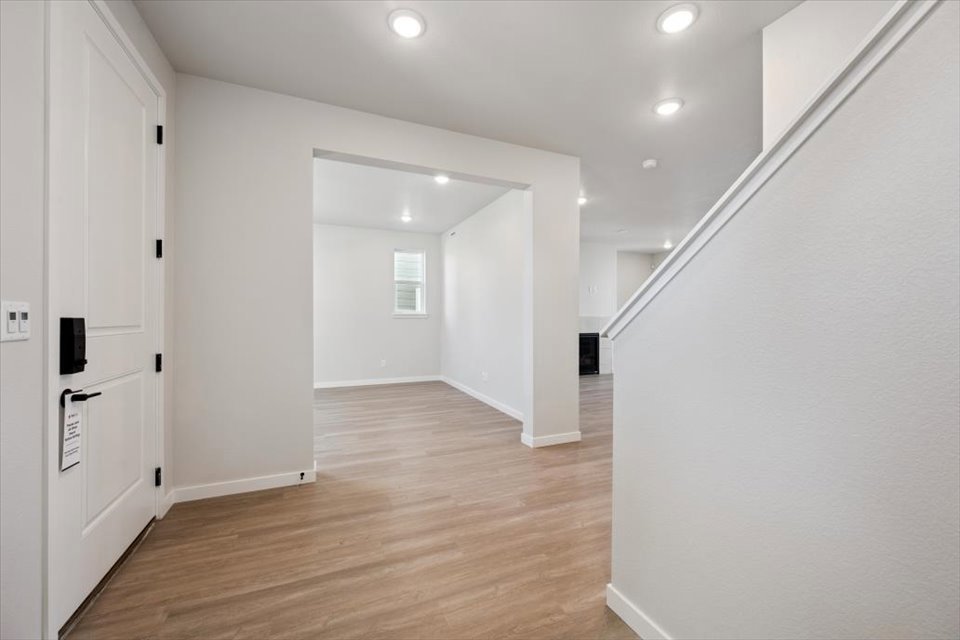 A hallway with white walls.
