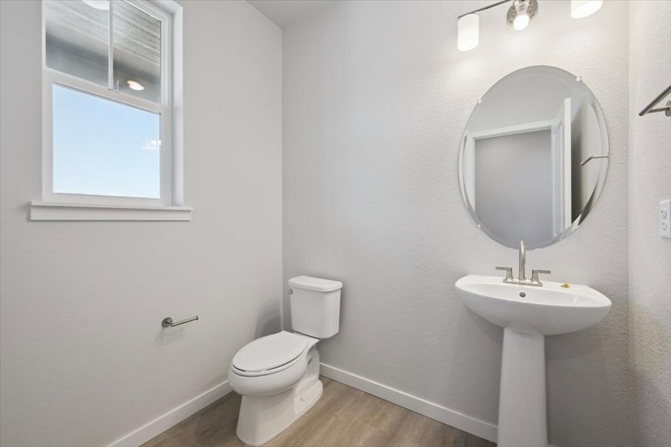 A bathroom with a sink and toilet.