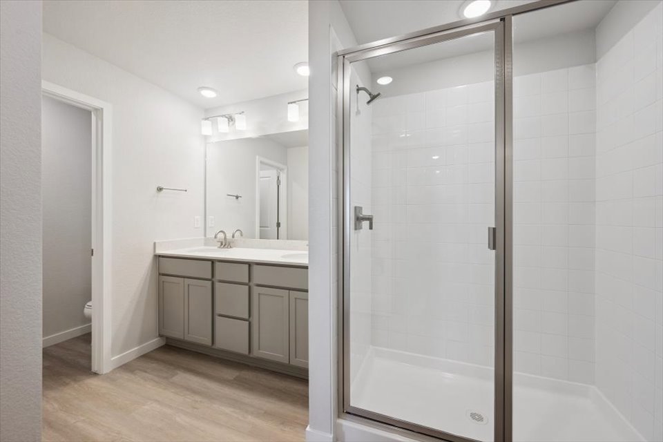 A bathroom with a glass shower.