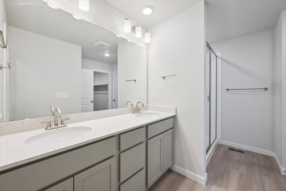 A bathroom with a large mirror.