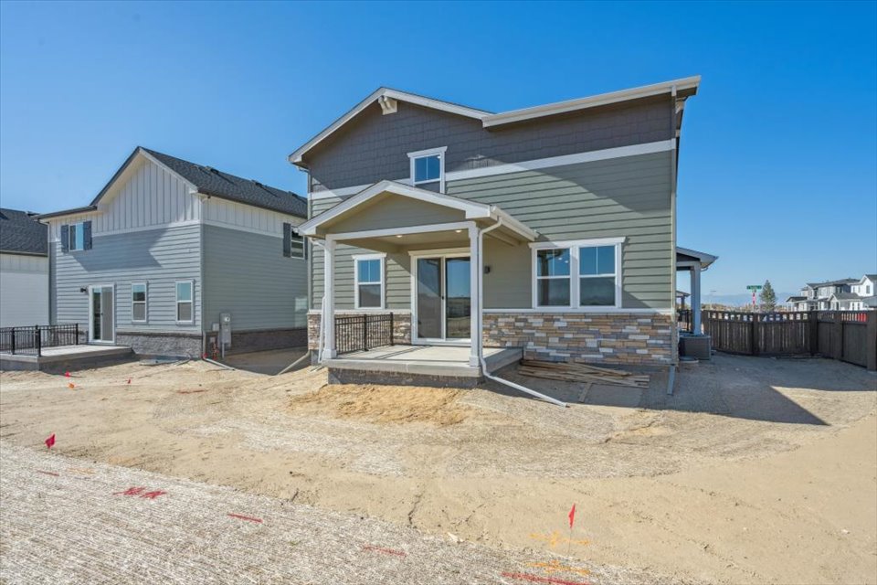 A house with a sandy yard.