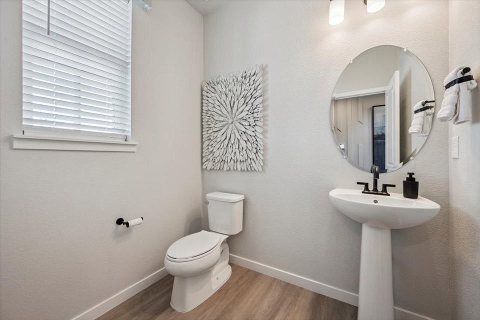 A bathroom with a mirror and sink.