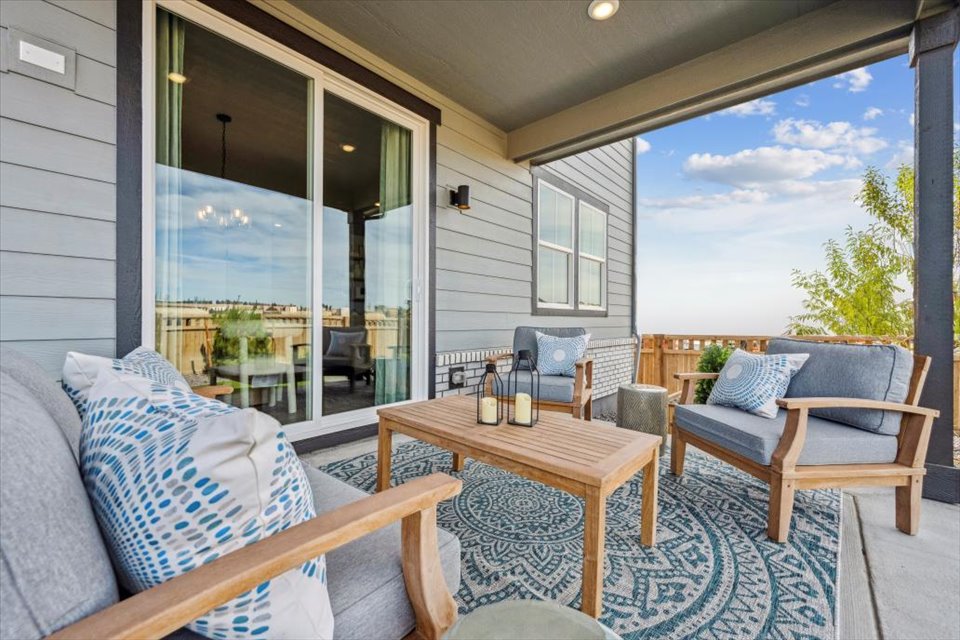 A living room with a table and chairs.