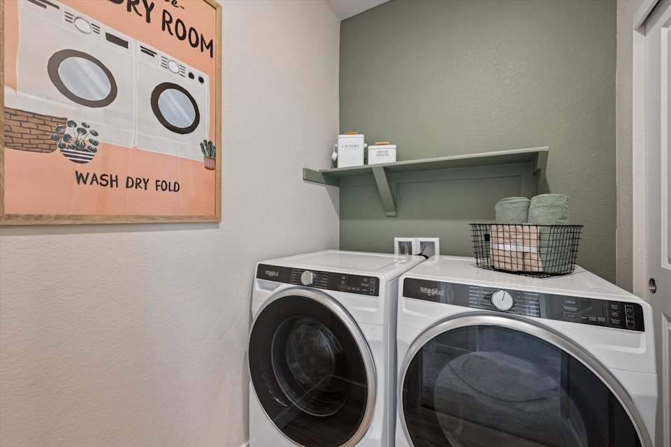 A laundry room with a washer and dryer.