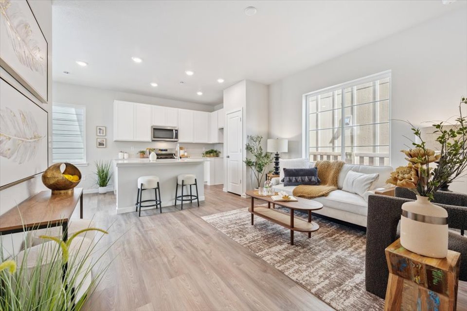 A living room with a wood floor.