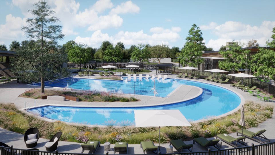 A swimming pool with chairs around it.