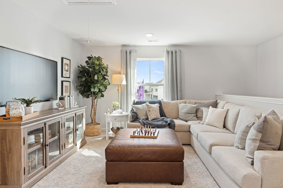A living room with a couch and a coffee table.