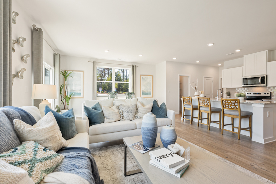 A living room with a wood floor.