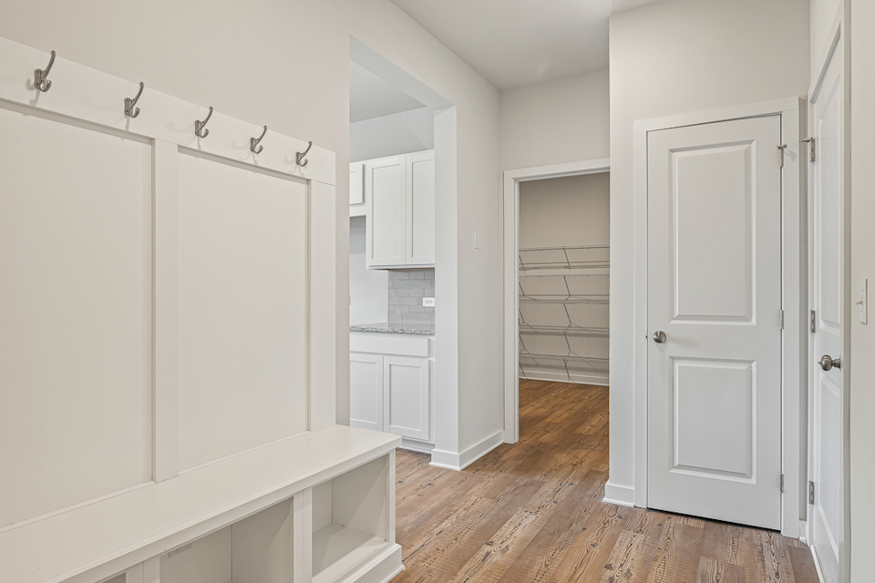 A white kitchen with white cabinets.