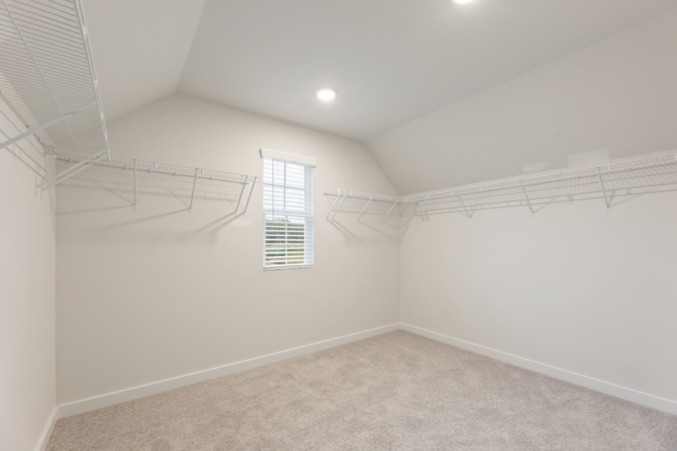 A white room with a staircase.