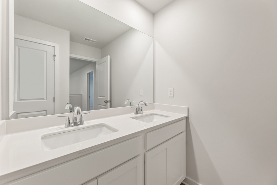 A bathroom with two sinks.