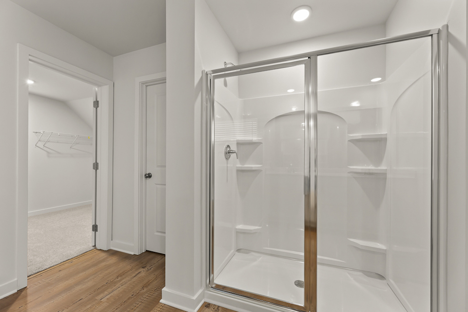 A bathroom with a glass shower.