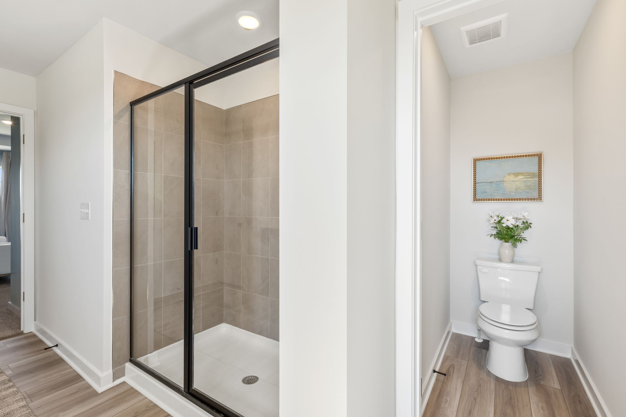 A bathroom with a glass shower.