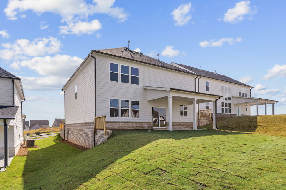 A house with a lawn in front.