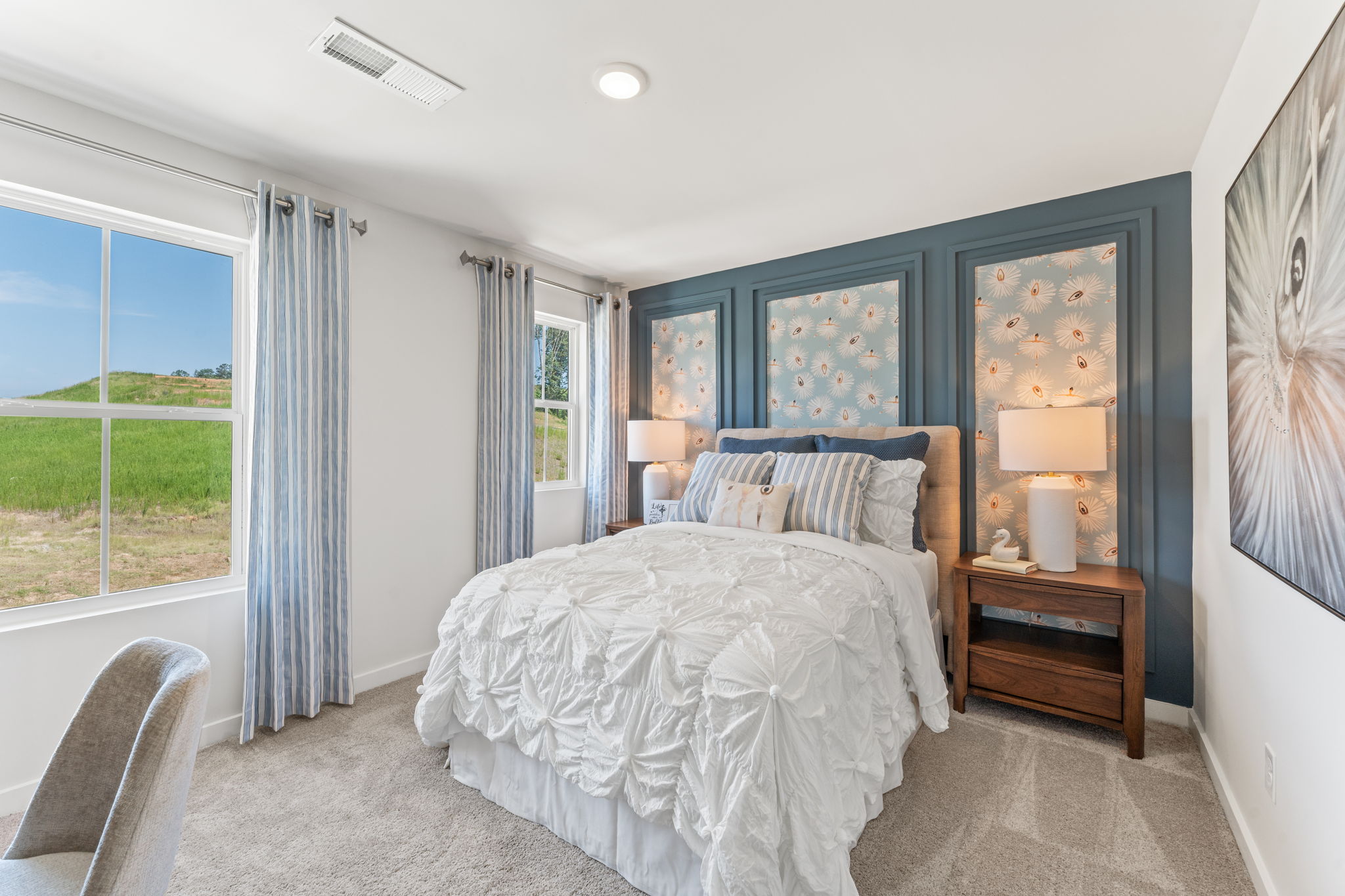 A bedroom with a bed and a window.