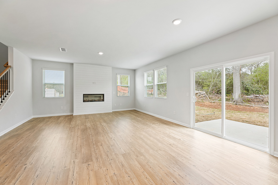 A room with a wood floor and a wood floor.