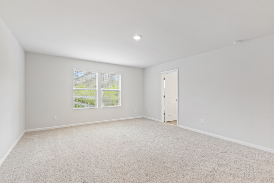 A room with a door and windows.