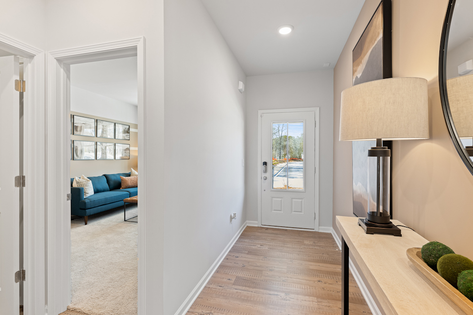 A living room with a blue couch.