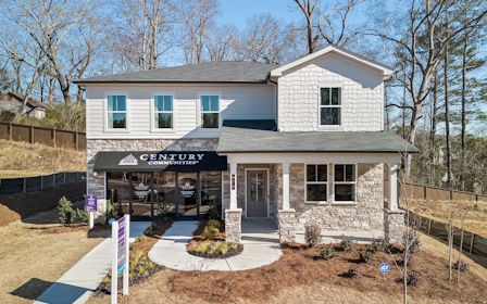 A house with a sign in front.