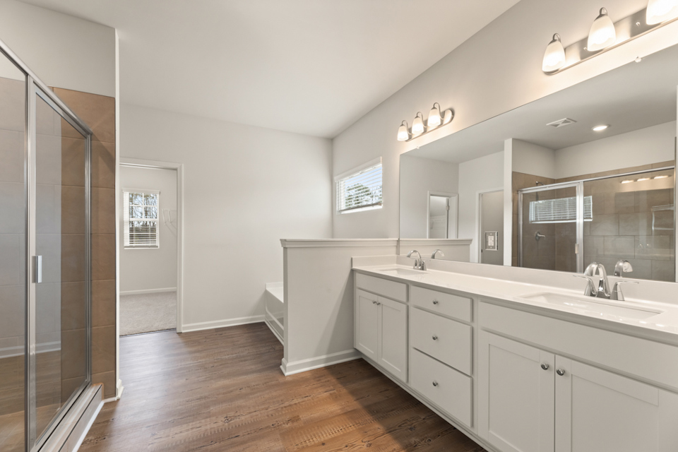 A bathroom with a glass shower.