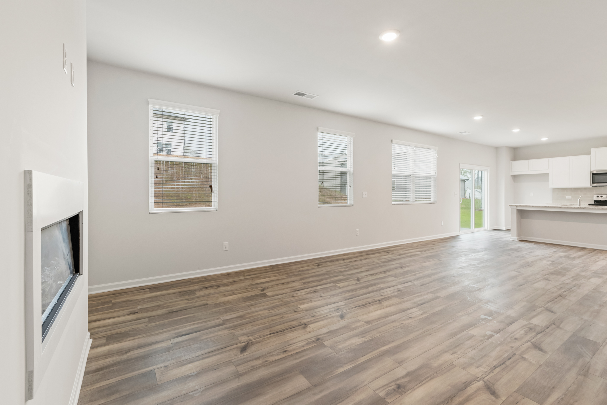 A room with a wood floor and a wood floor.