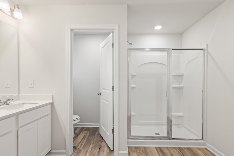 A bathroom with a glass shower.