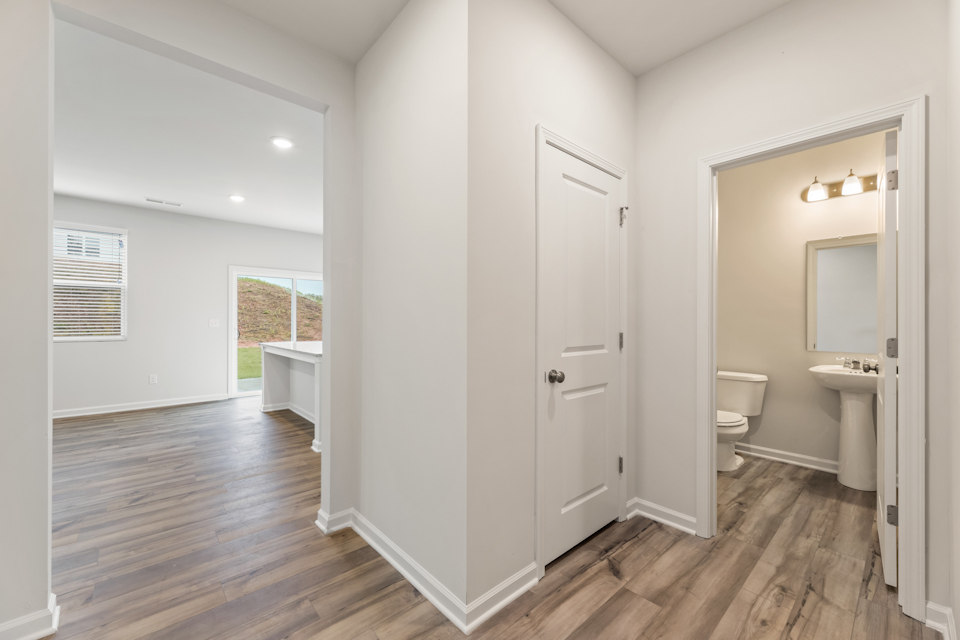 A bathroom with a wood floor.
