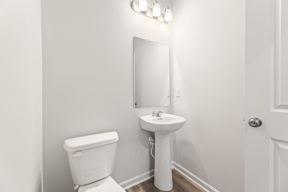 A bathroom with a sink and toilet.