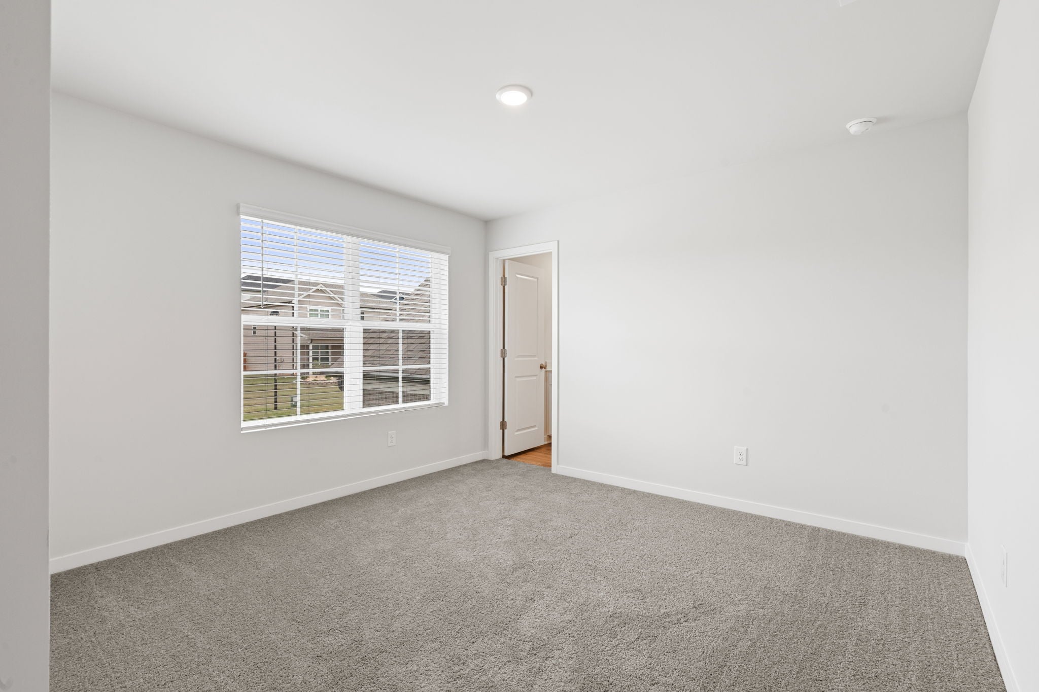 A room with a door and a window.