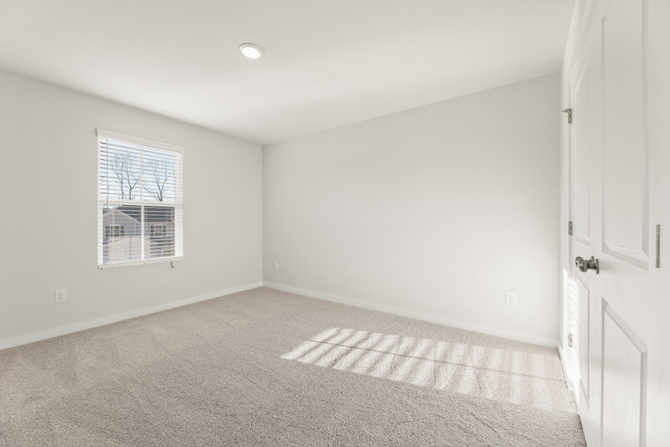 A room with a rug and a rug.