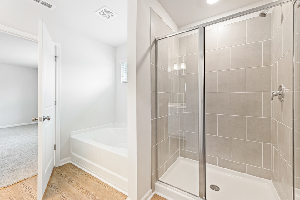 A bathroom with a glass shower.