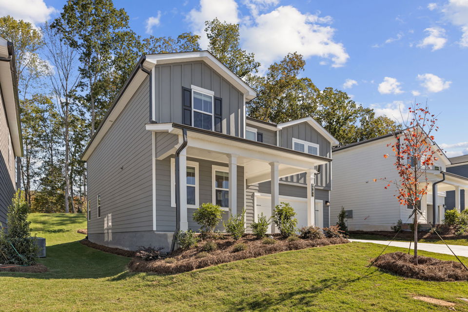 A house with a yard and trees.