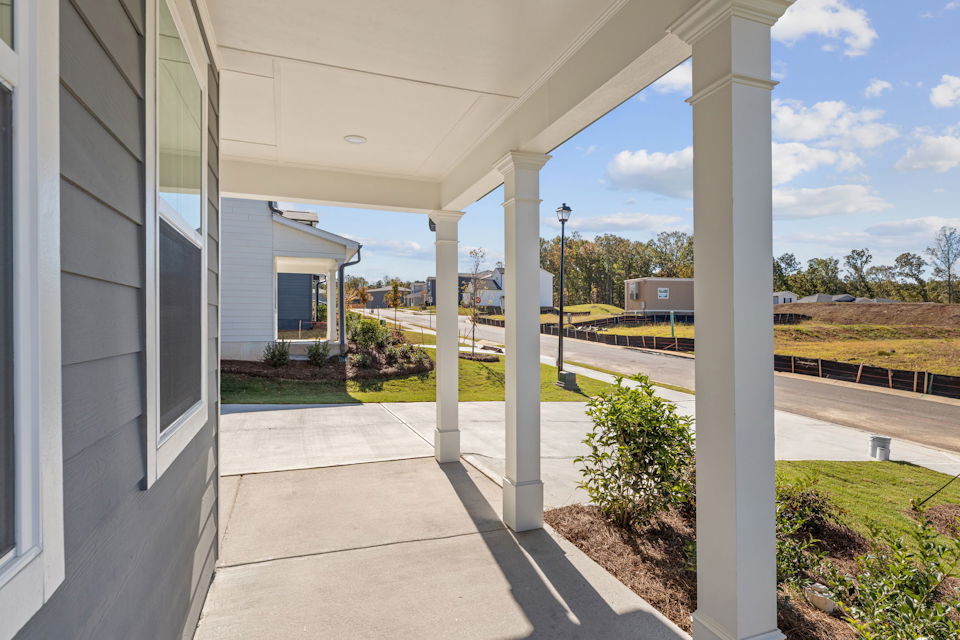 A building with pillars and a walkway.