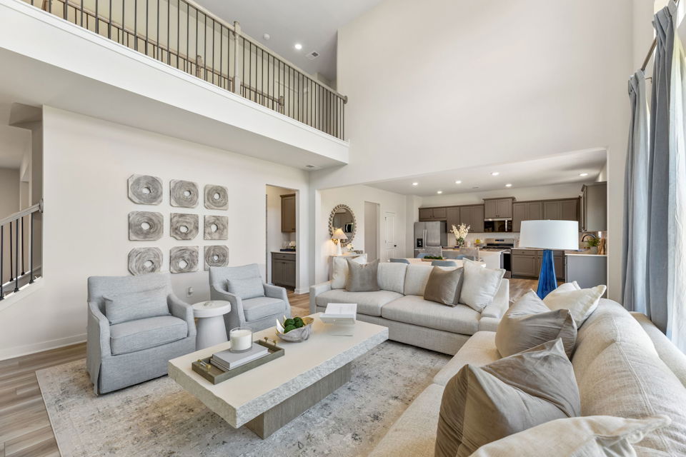 A living room with a couch and a table.