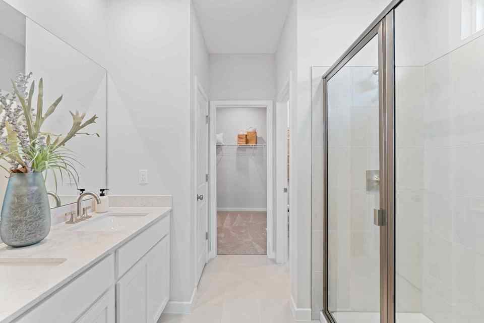 Laurel II Model Home Primary Bath with Dual Vanity Sink and Super Shower at Camden Woods in Kingsland, GA