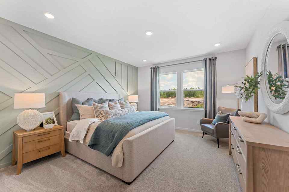 Laurel II Model Home Primary Bedroom with King Bed at Camden Woods in Kingsland, GA