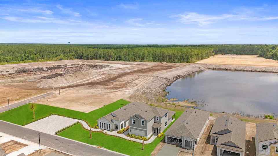 A flooded area with houses and a dam.