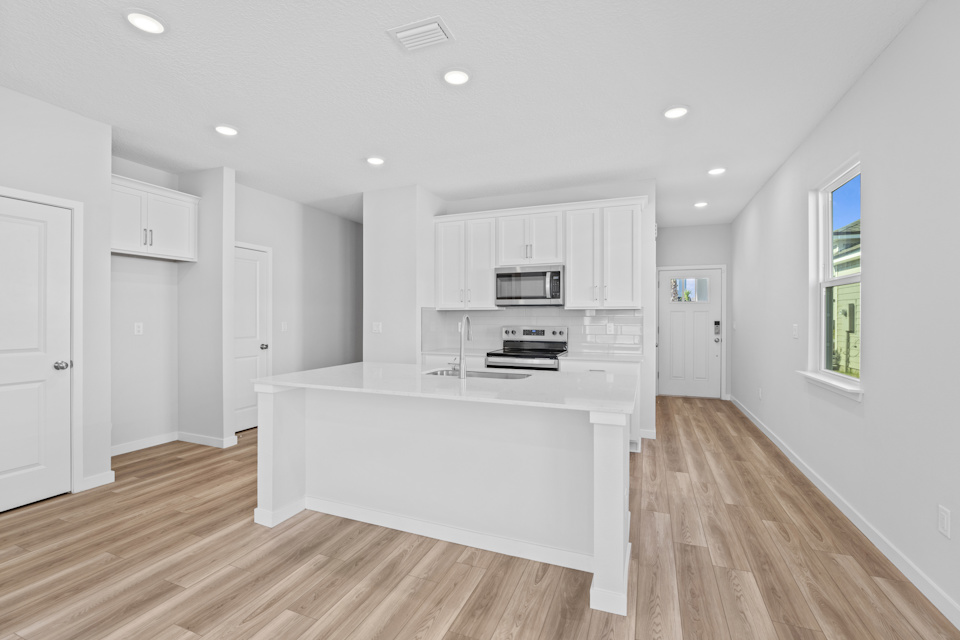 Lot 147 Kitchen with White Cabinets at Camden Woods in Kingsland