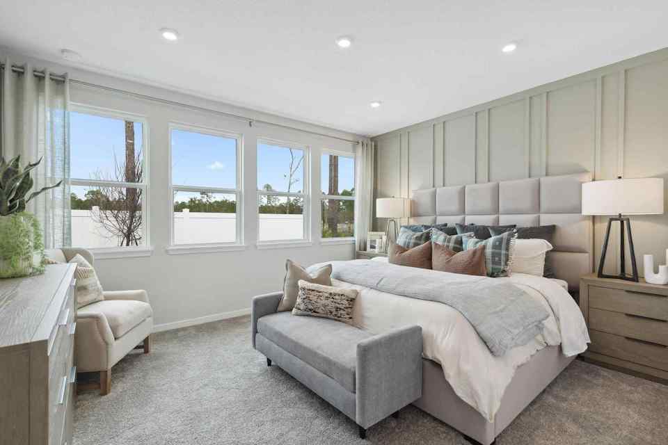 A living room with a couch and chairs.