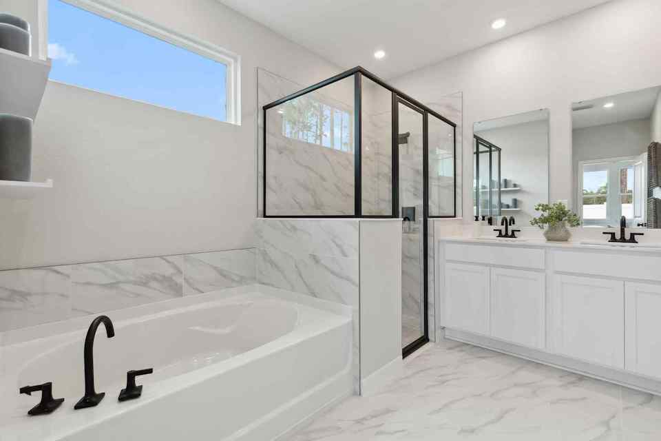 A bathroom with a tub and sink.