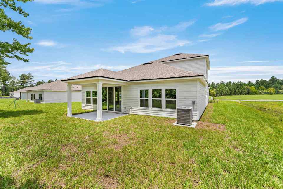 Dogwood Floor Plan Rear Exterior with Covered Patio at NorthShore in Kingsland
