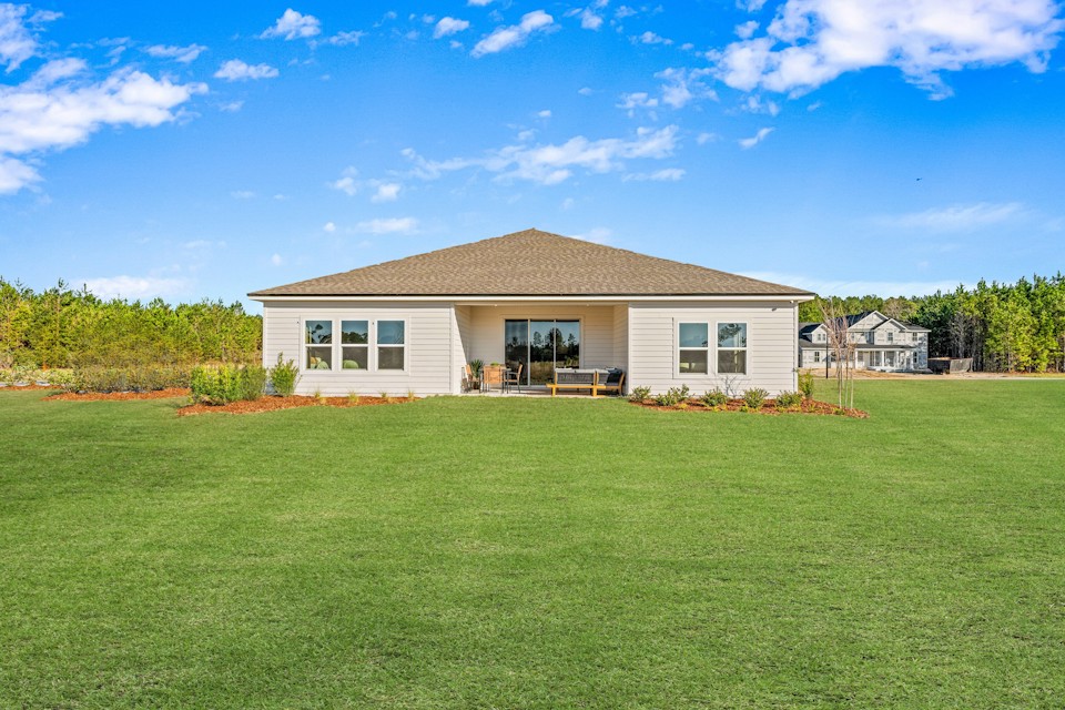 A house with a grass yard.